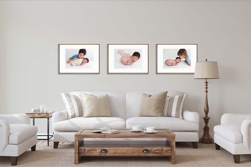 Framed baby portraits in a living room – Why Printing Photos Still Matters