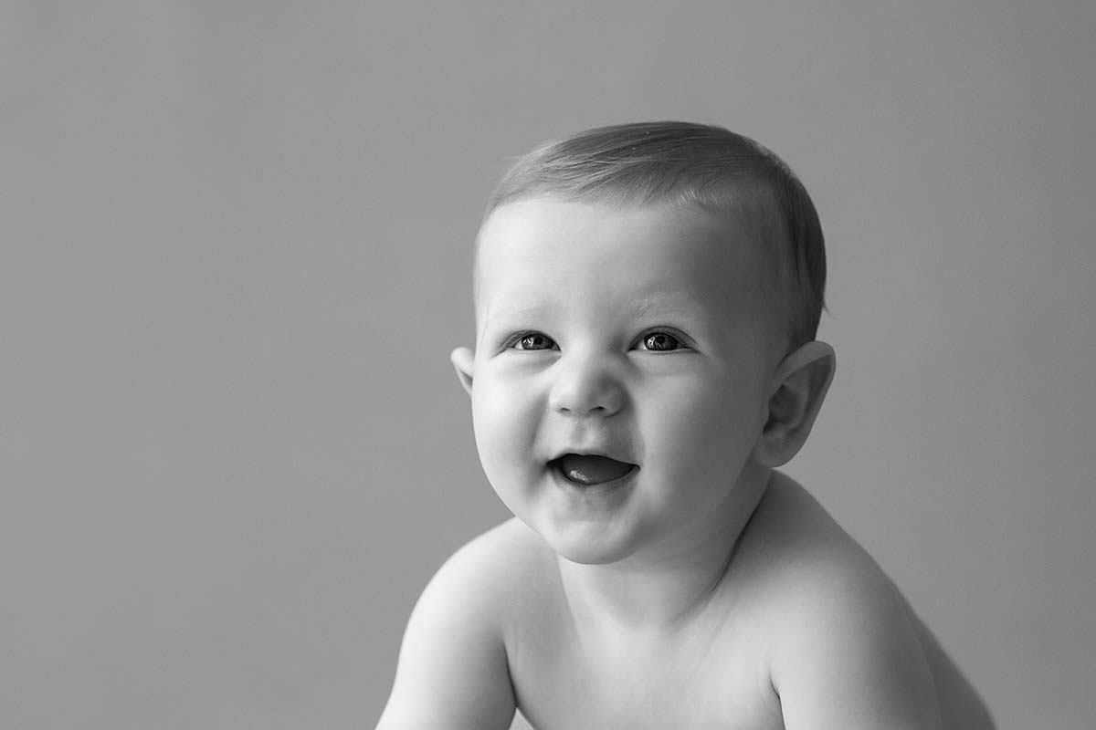 6 month old baby smiling - black and white photo