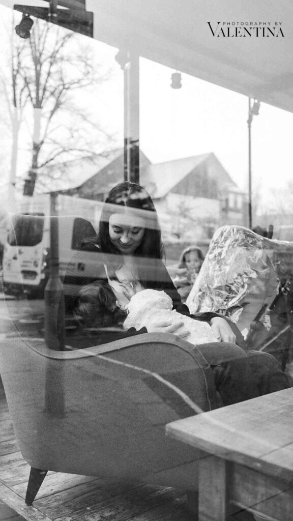 mum breastfeeding publicly in a cafe'