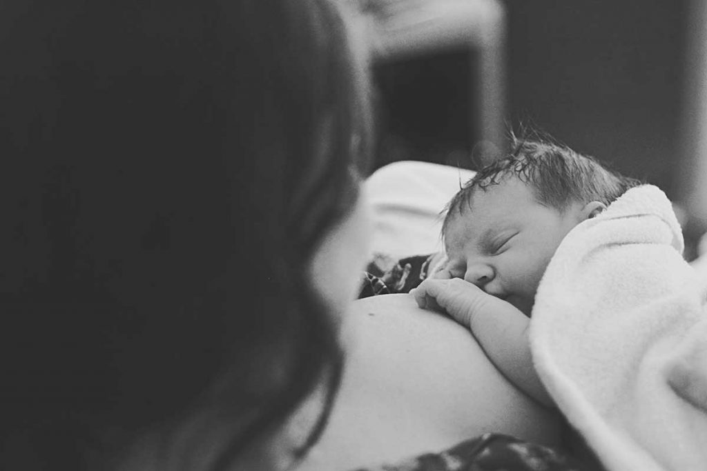 baby at birth laying on mum