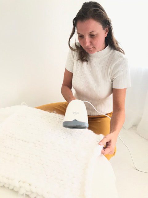 steaming a piece of delicate fabric used in newborn photography in my London studio