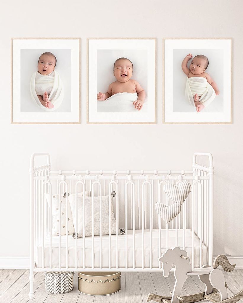 baby nursery - 3 frames with newborn photos hanging on the wall over the baby cot