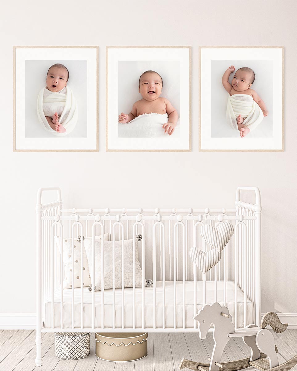 baby nursery - 3 frames with newborn photos hanging on the wall over the baby cot