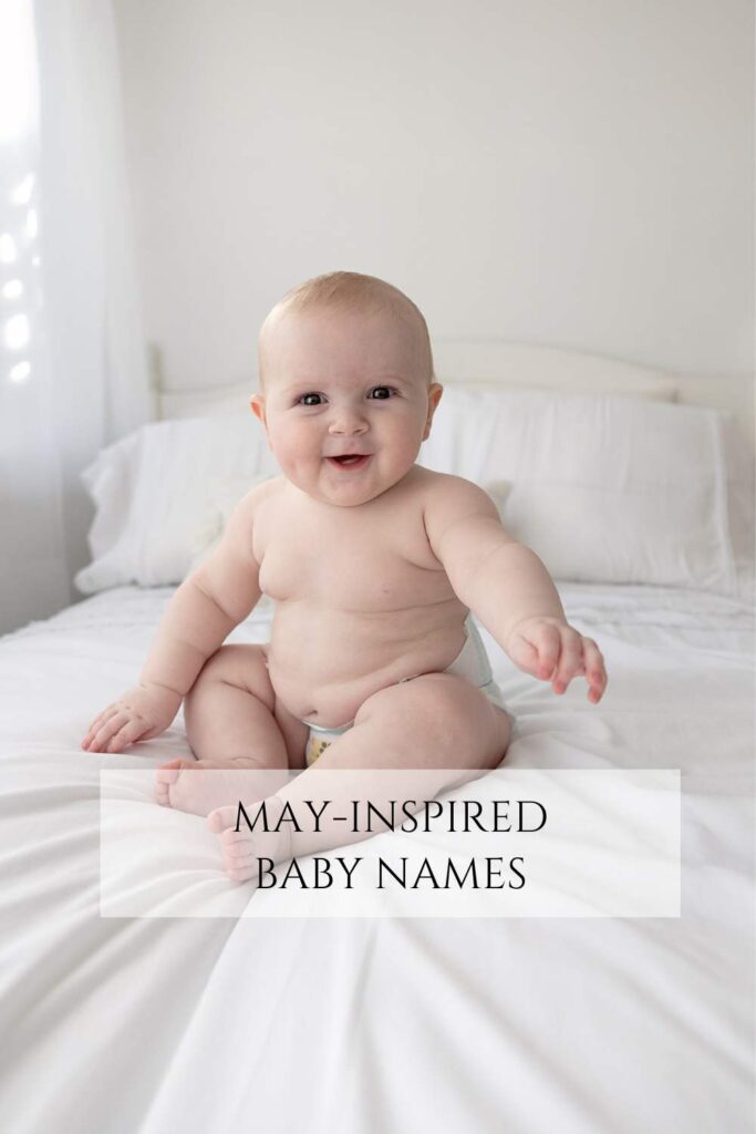 Graphic for May-Inspired Baby Names - baby sitting on a bed