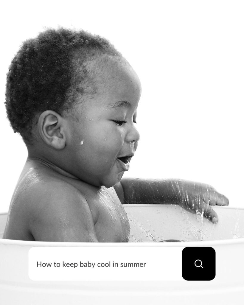 Baby splashing in a bath - having fun and keeping cool