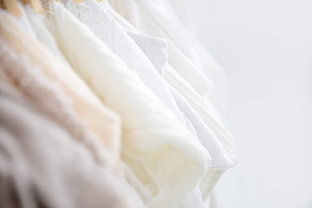 selection of newborn outfits available in the london studio