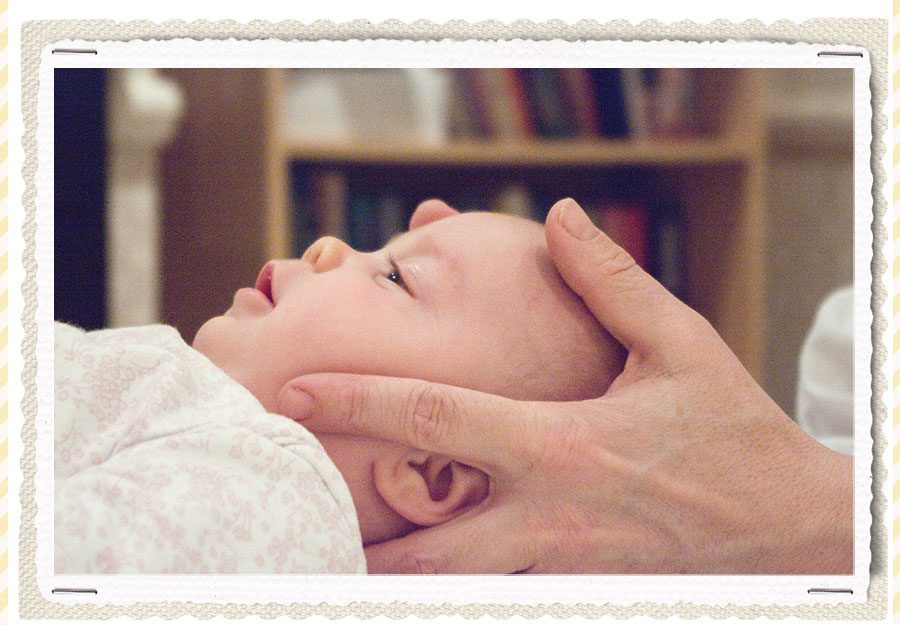 osteopath treating baby for flat head