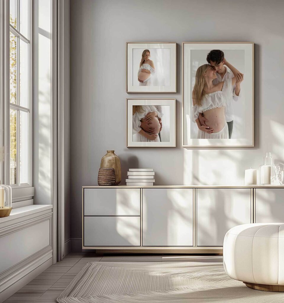 Framed maternity photos displayed on wall showing results of photo shoot for pregnant woman - professional pregnancy photography wall art in modern home.
