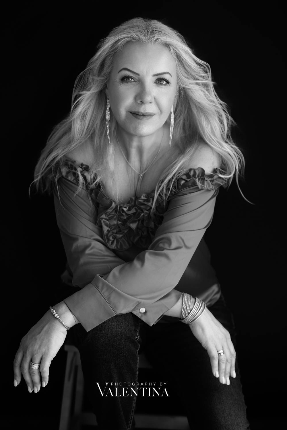 Elegant black-and-white portrait of a confident woman over 40, taken during a studio photoshoot by Photography by Valentina in London.