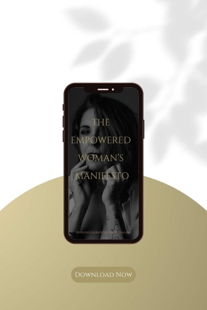 Phone mockup displaying The Empowered Woman’s Manifesto with a black and white portrait of a woman and gold text, encouraging self-celebration and empowerment