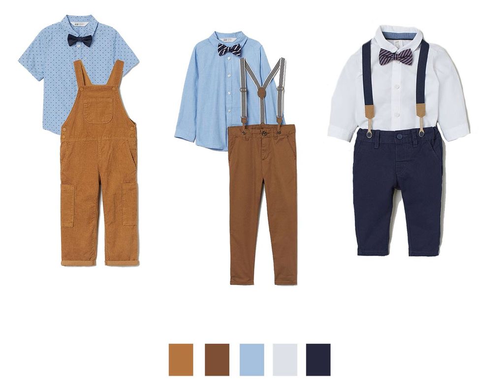Flat lay of boys’ holiday outfits with brown corduroy dungarees, light blue shirts, suspenders, and navy trousers, with a neutral and navy colour palette.