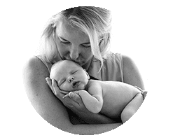 mum holding newborn baby and kissing her. Black and white image